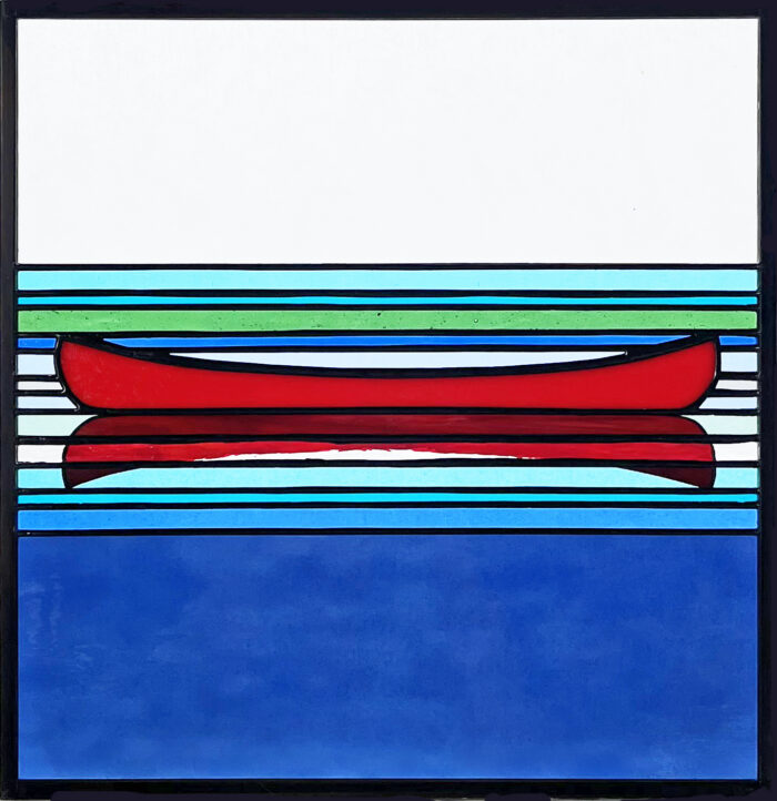 Modern stained glass piece by Lynn Chidwick of a canoe reflecting on blue water.